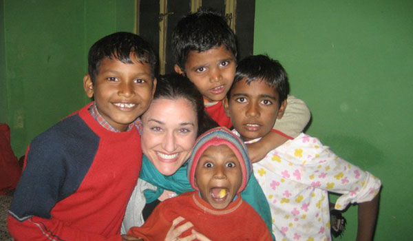 happy kids with volunteer in india
