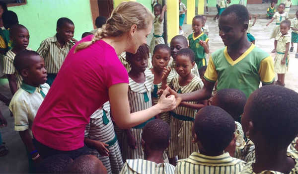 volunteer playing with students