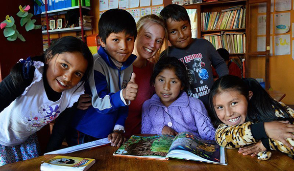 kids learning from volunteer